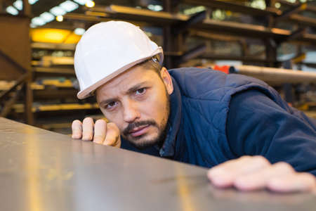 portrait of a metal engineer working at factoryの写真素材