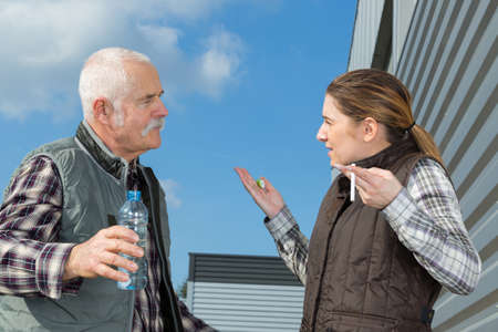 portrait of workers smoking cigaretteの写真素材
