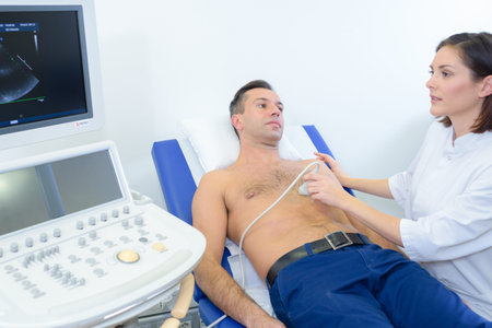 Male patient having chest scanの写真素材