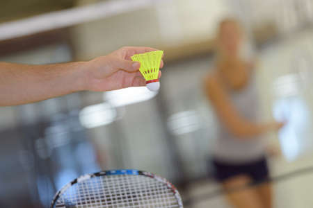 close up of shuttlecock in handの写真素材
