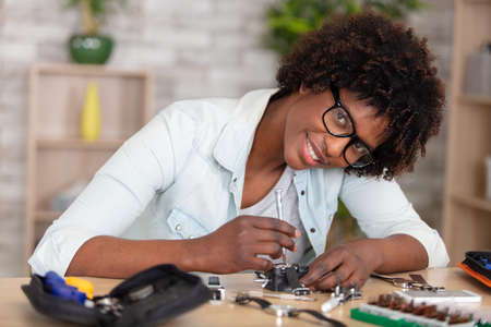 electronics repair tech fixed curcuit boardの写真素材