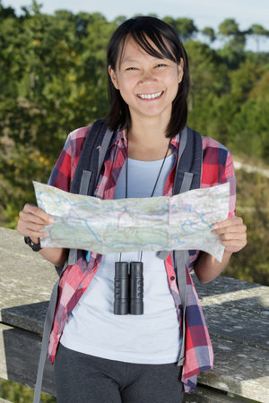 female hiker using a map