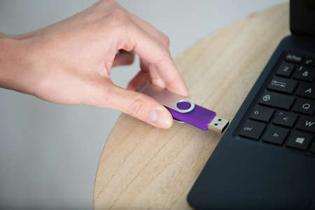 hand holding portable storage pen deviceの写真素材