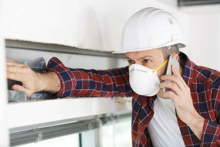 builder worker on the phoneの写真素材