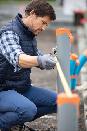 home renovation plumber fixing sewerage pipe at construction site