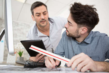 collaborative process of skilled students during brainstorming meeting in officeの写真素材