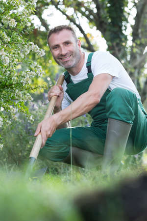 happy gardener or worker smiles at the cameraの写真素材