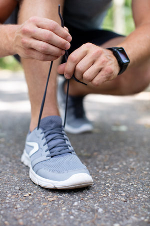loseup of hands tying shoe laces