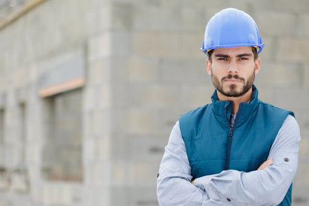 male builder construction worker on building site