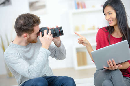 a couple testing the new cameraの写真素材