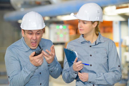 industrial worker with shocked facial expressionの写真素材