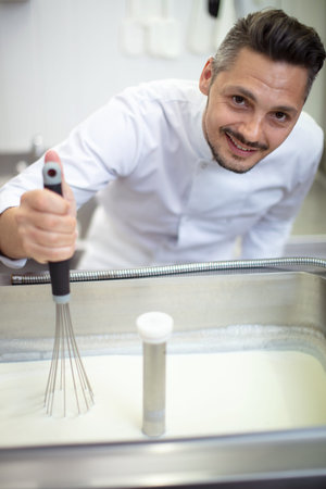 close up on a working ice cream machineの写真素材