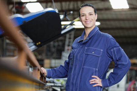 portrait of a female operative in a factory
