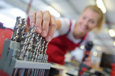 woman mechanic choosing the bolts