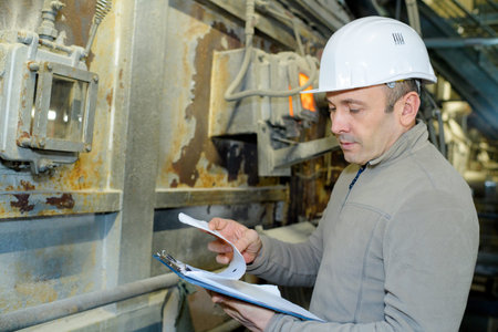 portrait of maintenance engineer checking data