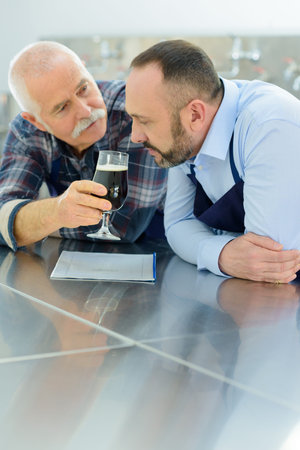 portrait of critical smelling black beer
