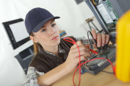 smart young woman testing 3d printing componentsの写真素材