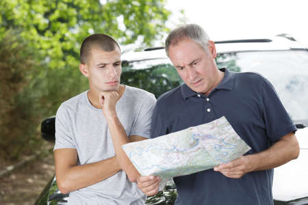 father and son during road trip checkinの写真素材