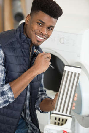 fixing washing machineの写真素材