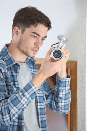 young professional cctv technician workingの写真素材