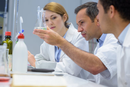 manager with 2 students in lab