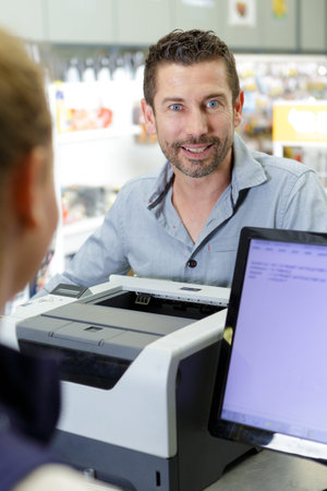 man paying in a warehouse store