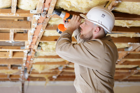 a man is drilling structureの写真素材