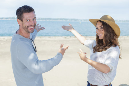 couple showing horizon to her boyfriendの写真素材