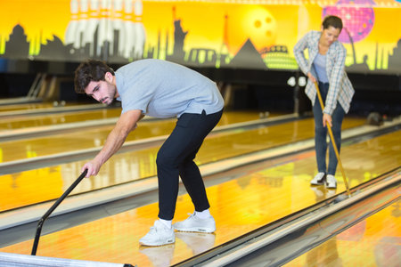 cleaning the bowling lanes