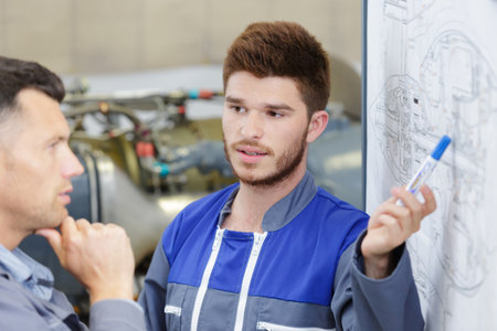 clever student explaining charts to teacherの写真素材