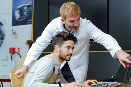 young apprentice using a computer