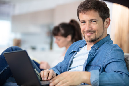 handsome businessman working with laptop in office