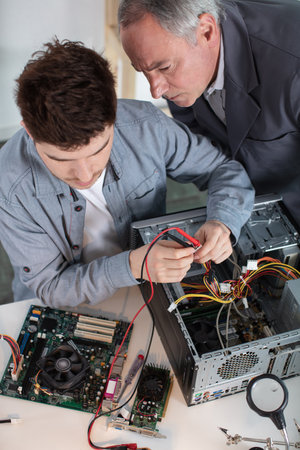 two it specialists working in the officeの写真素材