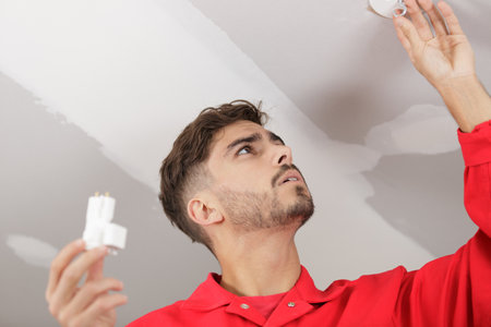 installing a spotlight in the roomの写真素材