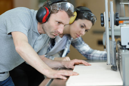 group mechanic engineer turner processes manufacturing in workshop