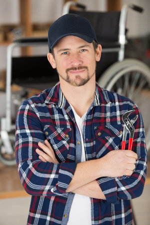 portrait of man after having fixed a wheelの写真素材