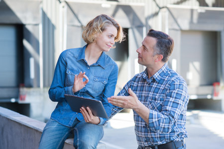 portrait of workers outside factoryの写真素材