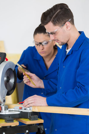student in carpentry class using circular saw