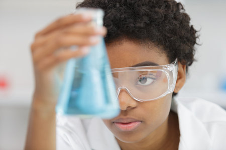 woman in the lab holding a flaskの写真素材