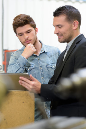 men working on a projectの写真素材