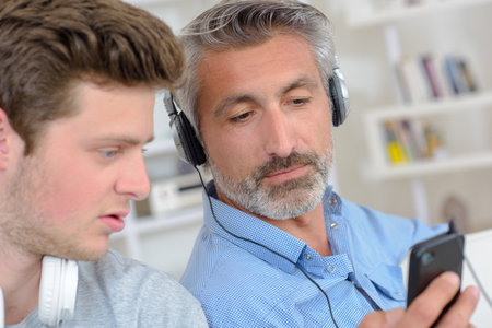 men in the living roomの写真素材