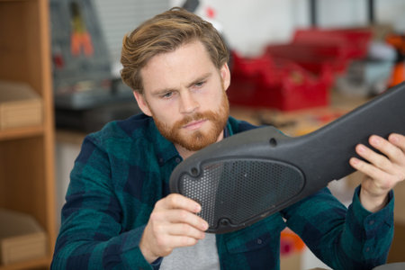 young guy at home repairing stuffs