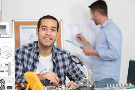 electronic engineers check digital multimeter indicatorsの写真素材