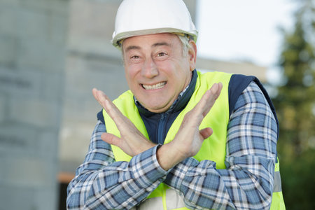 senior engineer standing confidently with a crossed armsの写真素材