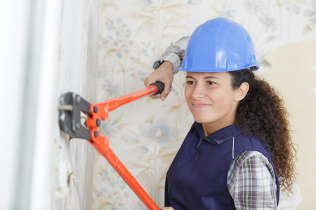 worker woman with scissors mowerの写真素材