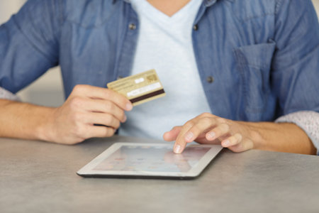 man buying online with a credit cardの写真素材