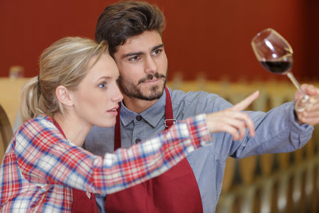 a couple working with wine
