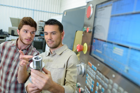 mechanical apprentice technician with mentorの写真素材