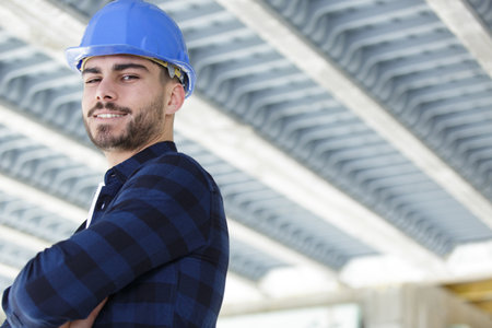 worker standing smiling on white backgroundの写真素材