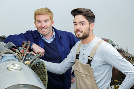 two flight engineers looking at the cameraの写真素材